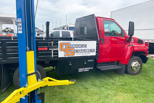 service truck with logo on the side of it