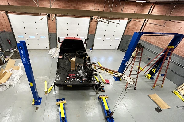 Garage Services team members in an outdoor booth